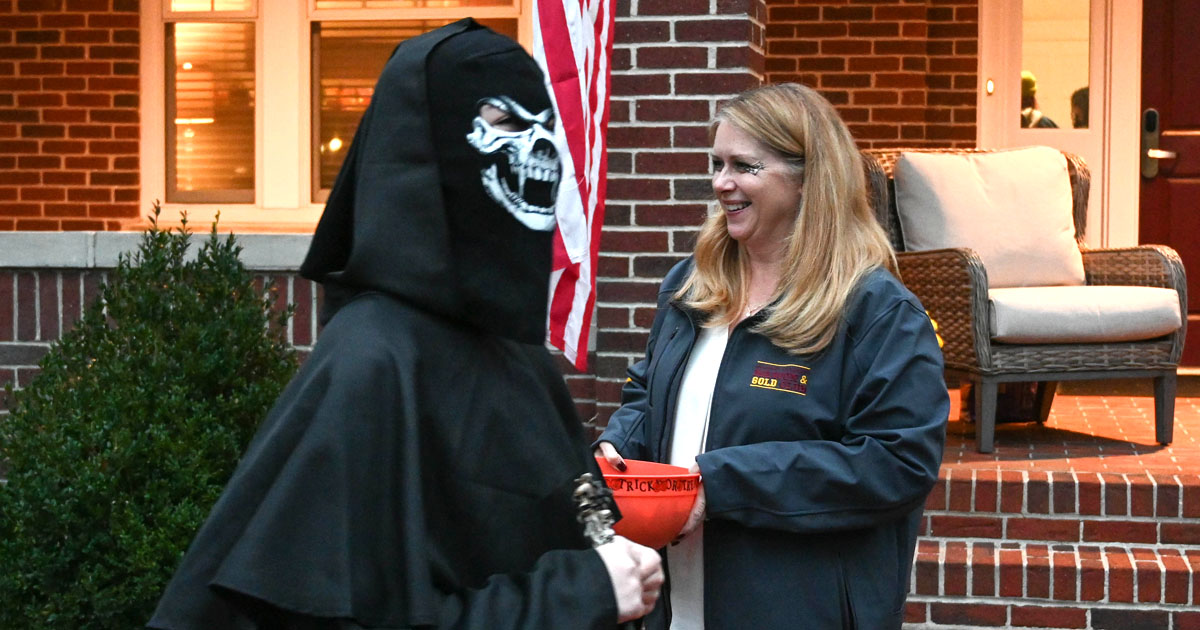 President Carolyn Ringer Lepre with trick-or-treater